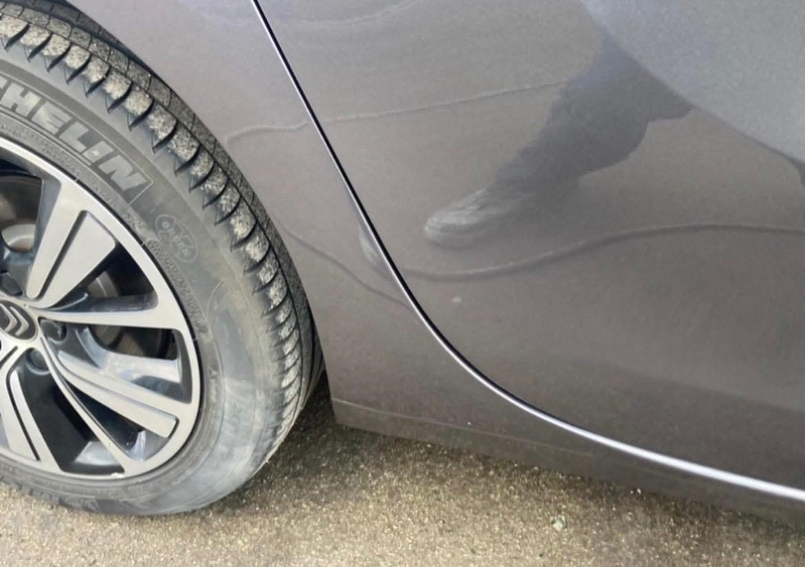 Rear quarter dent · before